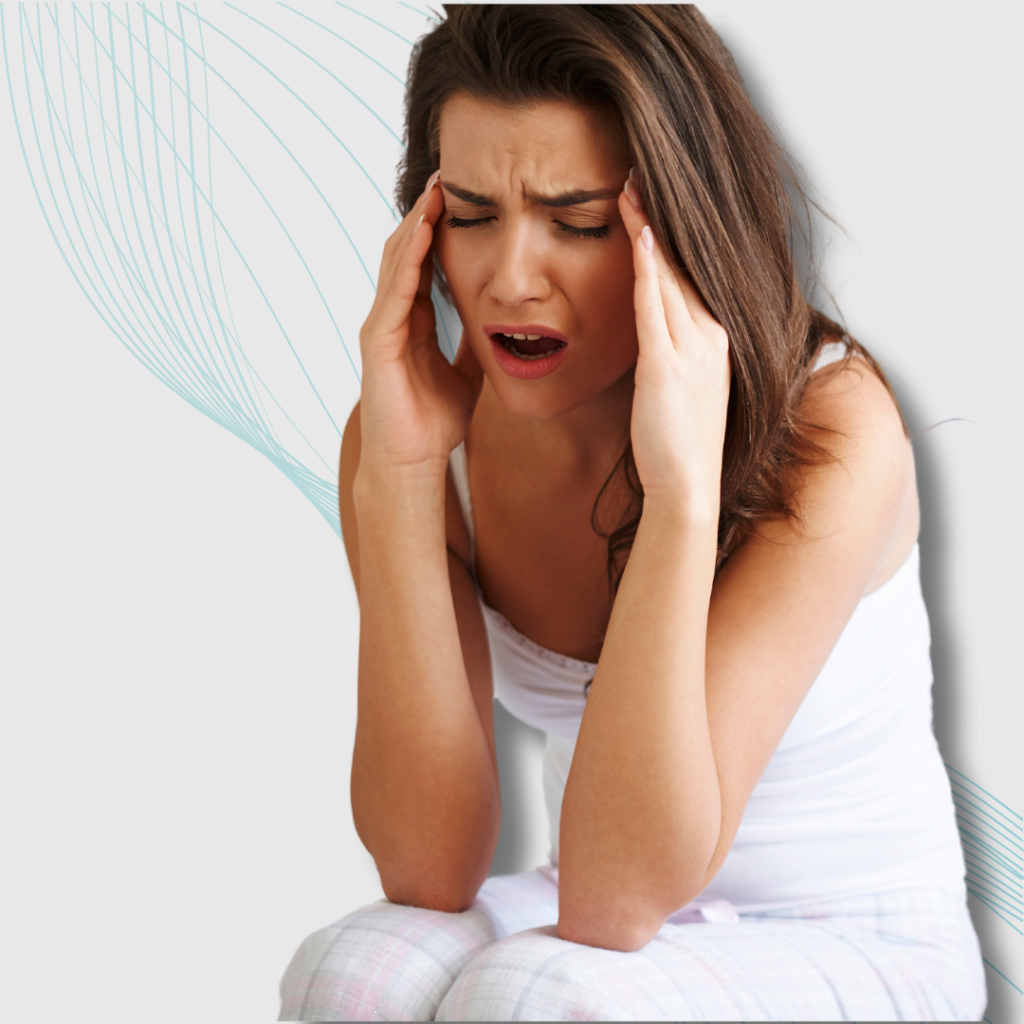 Woman with a pained expression clutching her head, suffering from a headache caused by poor posture.